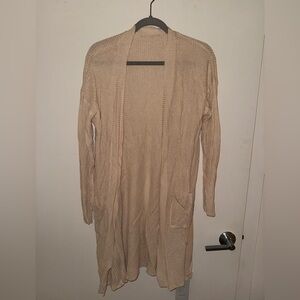 Long sleeved cardigan sweater, cream colored